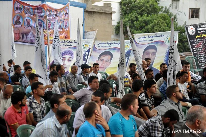 Palestinian supporters of al-Ahrar party take part a protest in the support of the prisoners who are on hunger strike, outside Red Cross Office, in Gaza city June 04, 2014. About 120 Palestinians imprisoned without trial...