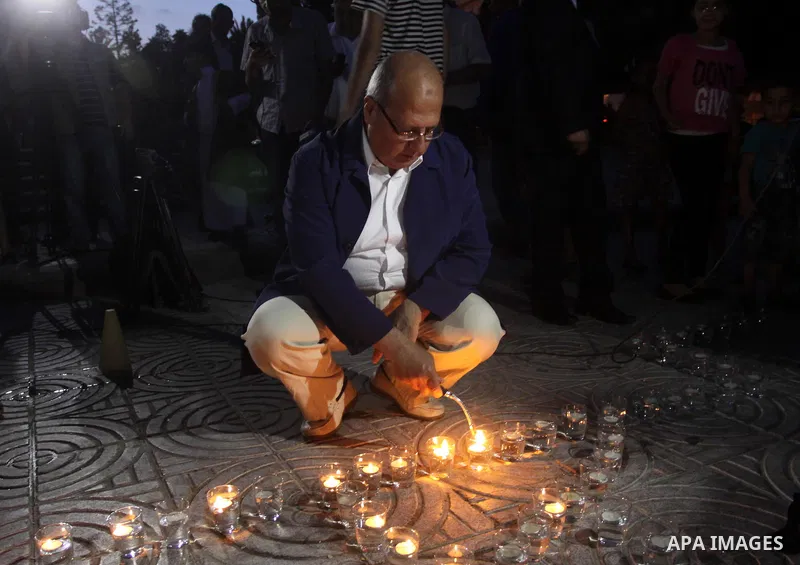 A Palestinian man lights candles during a protest in solidarity with prisoners on hunger strike, in Gaza City June 5, 2014. Some 120 Palestinians jailed without trial in Israel have been on an open-ended hunger strike, e...
