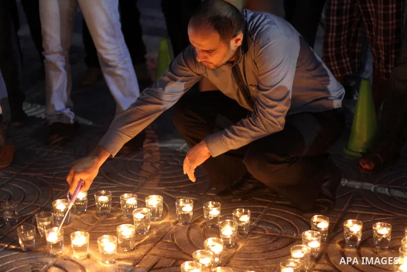 A Palestinian man lights candles during a protest in solidarity with prisoners on hunger strike, in Gaza City June 5, 2014. Some 120 Palestinians jailed without trial in Israel have been on an open-ended hunger strike, e...