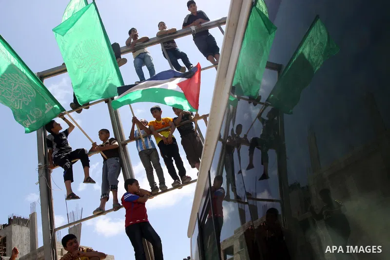 Palestinians take part in Friday prayers during a rally in solidarity with prisoners on hunger strike, outside Red Cross office in Gaza City on June 6, 2014. Some 120 Palestinians jailed without trial in Israel have been...