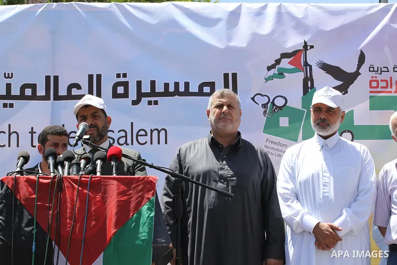 Palestinians take part in a rally in solidarity with prisoners on hunger strike, and the global alliance for the support of Al-Quds (Jerusalem) outside Red Cross office in Gaza City on June 6, 2014. Some 120 Palestinians...