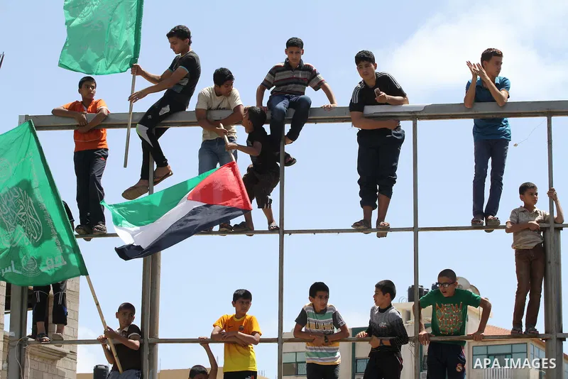 Palestinians take part in a rally in solidarity with prisoners on hunger strike, and the global alliance for the support of Al-Quds (Jerusalem) outside Red Cross office in Gaza City on June 6, 2014. Some 120 Palestinians...
