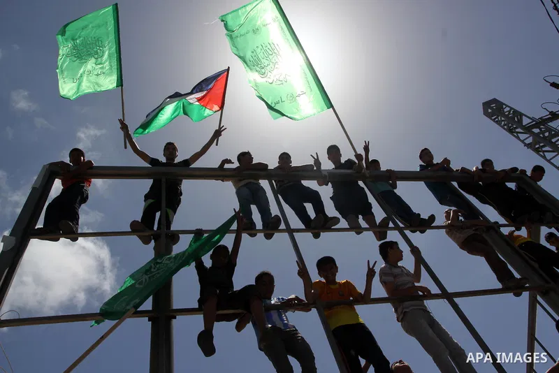 Palestinians take part in Friday prayers during a rally in solidarity with prisoners on hunger strike, outside Red Cross office in Gaza City on June 6, 2014. Some 120 Palestinians jailed without trial in Israel have been...