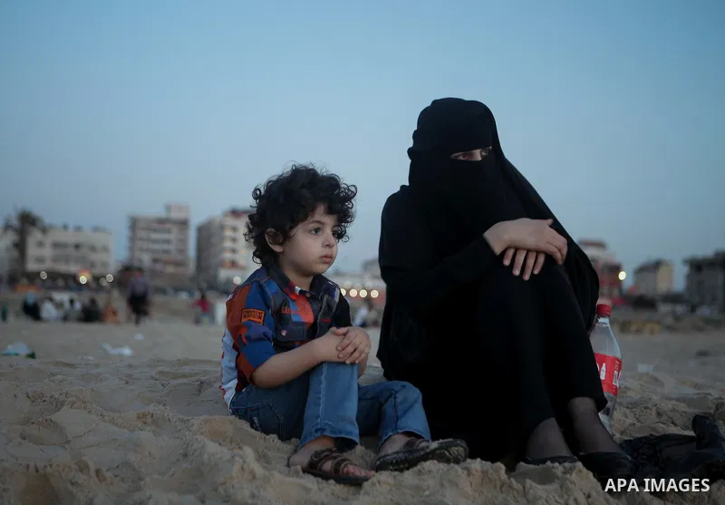 Palestinians children enjoy a summer day at the beach in Gaza city, on June 6, 2014. Friday is the Muslim holiday and as summer is entering many Palestinian people go to the beach since it is the major entertainment area...
