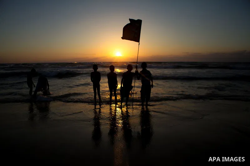 Palestinians children enjoy a summer day at the beach in Gaza city, on June 6, 2014. Friday is the Muslim holiday and as summer is entering many Palestinian people go to the beach since it is the major entertainment area...