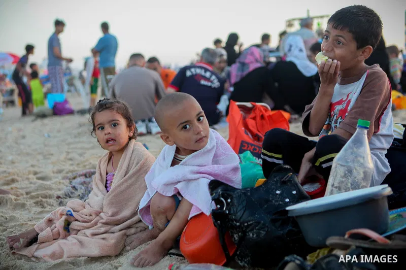 Palestinians children enjoy a summer day at the beach in Gaza city, on June 6, 2014. Friday is the Muslim holiday and as summer is entering many Palestinian people go to the beach since it is the major entertainment area...