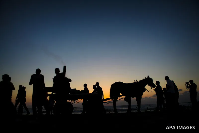 Palestinians children enjoy a summer day at the beach in Gaza city, on June 6, 2014. Friday is the Muslim holiday and as summer is entering many Palestinian people go to the beach since it is the major entertainment area...