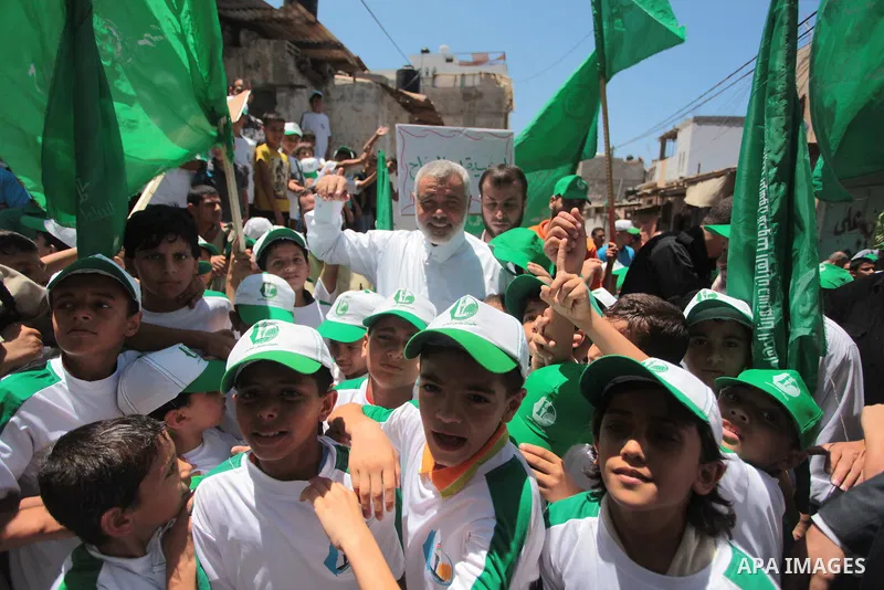 Senior leader of Hamas Ismail Haniyeh attends a summer camp organized by Hamas on June 7, 2014. Thousands of elementary school students in the Gaza Strip are going to Hamas summer camps, in which they take part in recrea...