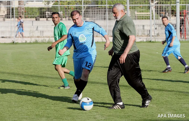 Senior leader of Hamas Ismail Haniyeh participates in football match in solidarity with prisoners on hunger strike held in Israeli jails in Gaza city, on June 7, 2014. Some 120 Palestinians jailed without trial in Israel...