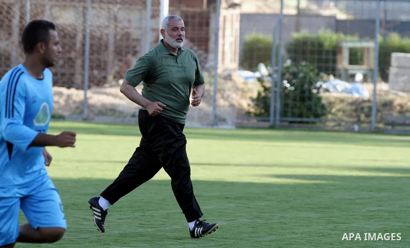 Senior leader of Hamas Ismail Haniyeh participates in football match in solidarity with prisoners on hunger strike held in Israeli jails in Gaza city, on June 7, 2014. Some 120 Palestinians jailed without trial in Israel...