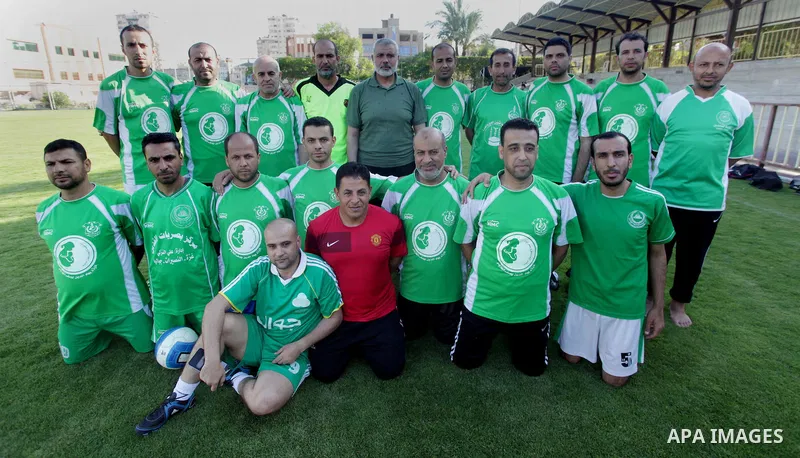 Senior leader of Hamas Ismail Haniyeh participates in football match in solidarity with prisoners on hunger strike held in Israeli jails in Gaza city, on June 7, 2014. Some 120 Palestinians jailed without trial in Israel...