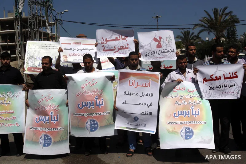 Palestinian journalists and media members take part in a demonstration in support of Palestinian prisoners on hunger strike in Israeli jails, outside Red Cross office, in Gaza City on June 8, 2014. U.N. Secretary-General...