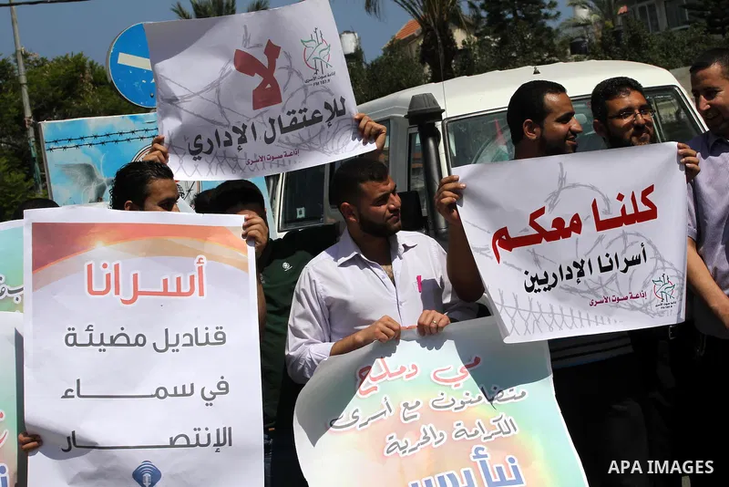 Palestinian journalists and media members take part in a demonstration in support of Palestinian prisoners on hunger strike in Israeli jails, outside Red Cross office, in Gaza City on June 8, 2014. U.N. Secretary-General...