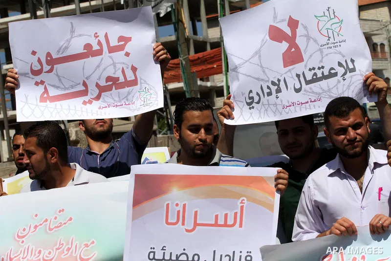Palestinian journalists and media members take part in a demonstration in support of Palestinian prisoners on hunger strike in Israeli jails, outside Red Cross office, in Gaza City on June 8, 2014. U.N. Secretary-General...