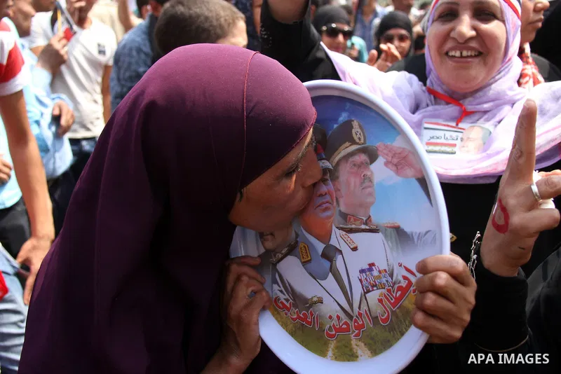 Egyptians celebrate upon the completion of the swearing-in ceremony by President elect Abdel Fattah al-Sissi, in Tahrir square, Cairo, Egypt, 08 June 2014. Former army chief Abdel Fattah al-Sissi was on 08 June, sworn in...