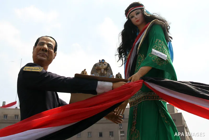 Egyptians celebrate upon the completion of the swearing-in ceremony by President elect Abdel Fattah al-Sissi, in Tahrir square, Cairo, Egypt, 08 June 2014. Former army chief Abdel Fattah al-Sissi was on 08 June, sworn in...
