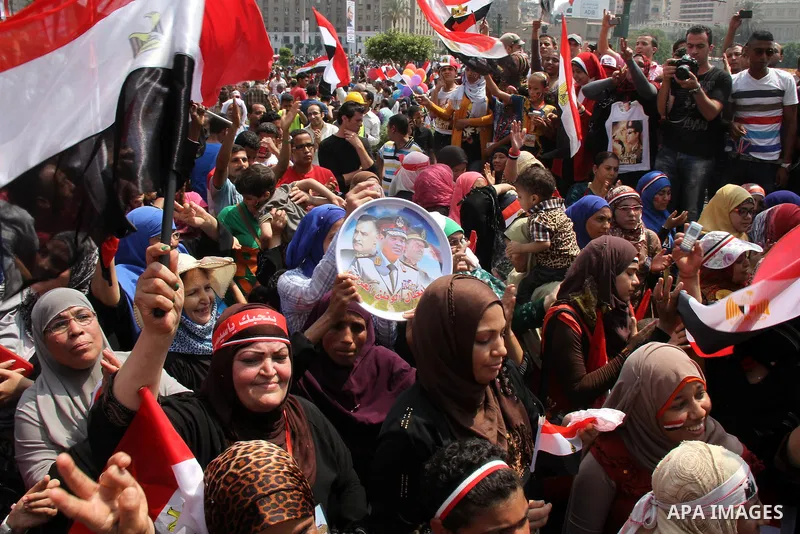Egyptians celebrate upon the completion of the swearing-in ceremony by President elect Abdel Fattah al-Sissi, in Tahrir square, Cairo, Egypt, 08 June 2014. Former army chief Abdel Fattah al-Sissi was on 08 June, sworn in...