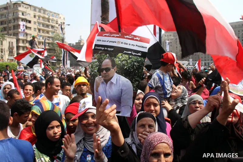 Egyptians celebrate upon the completion of the swearing-in ceremony by President elect Abdel Fattah al-Sissi, in Tahrir square, Cairo, Egypt, 08 June 2014. Former army chief Abdel Fattah al-Sissi was on 08 June, sworn in...