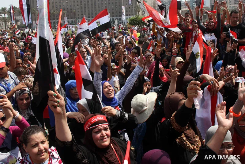 Egyptians celebrate upon the completion of the swearing-in ceremony by President elect Abdel Fattah al-Sissi, in Tahrir square, Cairo, Egypt, 08 June 2014. Former army chief Abdel Fattah al-Sissi was on 08 June, sworn in...