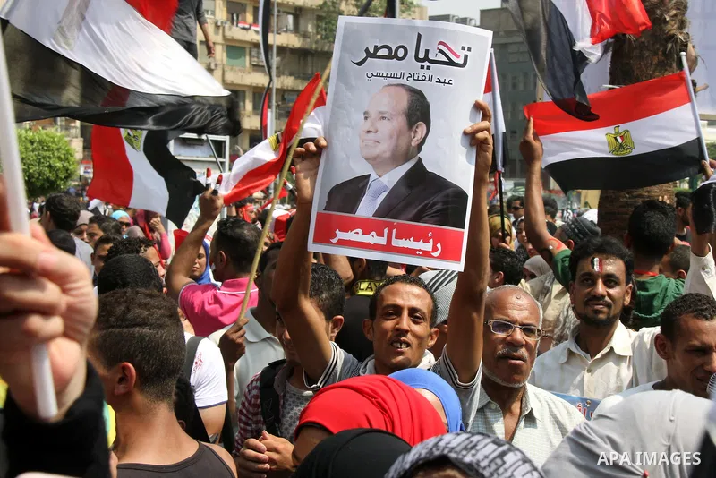Egyptians celebrate upon the completion of the swearing-in ceremony by President elect Abdel Fattah al-Sissi, in Tahrir square, Cairo, Egypt, 08 June 2014. Former army chief Abdel Fattah al-Sissi was on 08 June, sworn in...