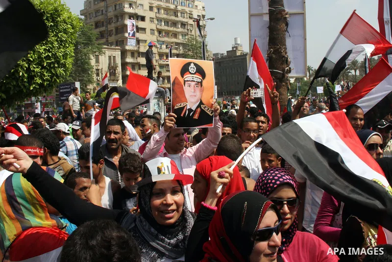 Egyptians celebrate upon the completion of the swearing-in ceremony by President elect Abdel Fattah al-Sissi, in Tahrir square, Cairo, Egypt, 08 June 2014. Former army chief Abdel Fattah al-Sissi was on 08 June, sworn in...