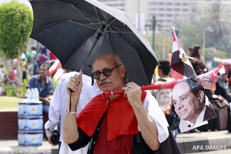 Egyptians celebrate upon the completion of the swearing-in ceremony by President elect Abdel Fattah al-Sissi, in Tahrir square, Cairo, Egypt, 08 June 2014. Former army chief Abdel Fattah al-Sissi was on 08 June, sworn in...
