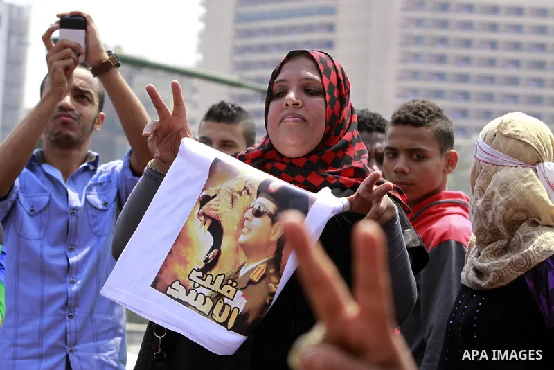 Egyptians celebrate upon the completion of the swearing-in ceremony by President elect Abdel Fattah al-Sissi, in Tahrir square, Cairo, Egypt, 08 June 2014. Former army chief Abdel Fattah al-Sissi was on 08 June, sworn in...