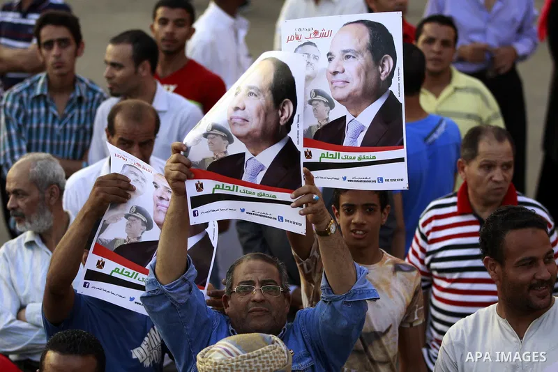 Egyptians celebrate upon the completion of the swearing-in ceremony by President elect Abdel Fattah al-Sissi, in Tahrir square, Cairo, Egypt, 08 June 2014. Former army chief Abdel Fattah al-Sissi was on 08 June, sworn in...