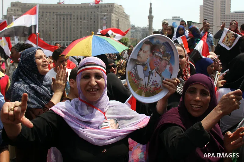 Egyptians celebrate upon the completion of the swearing-in ceremony by President elect Abdel Fattah al-Sissi, in Tahrir square, Cairo, Egypt, 08 June 2014. Former army chief Abdel Fattah al-Sissi was on 08 June, sworn in...