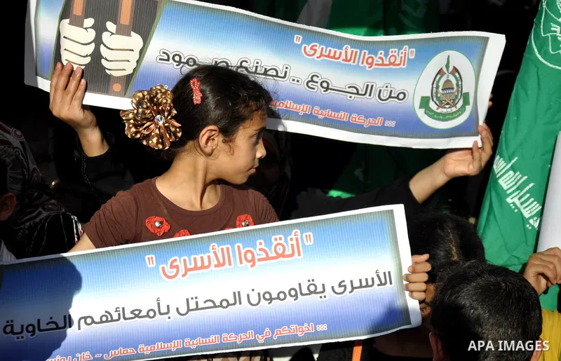 Palestinians take part in a demonstration in support of 125 Palestinian prisoners detained in Israeli jails and who have been on hunger strike for six weeks, outside Red Cross office, in Gaza City on June 09, 2014. 285 P...