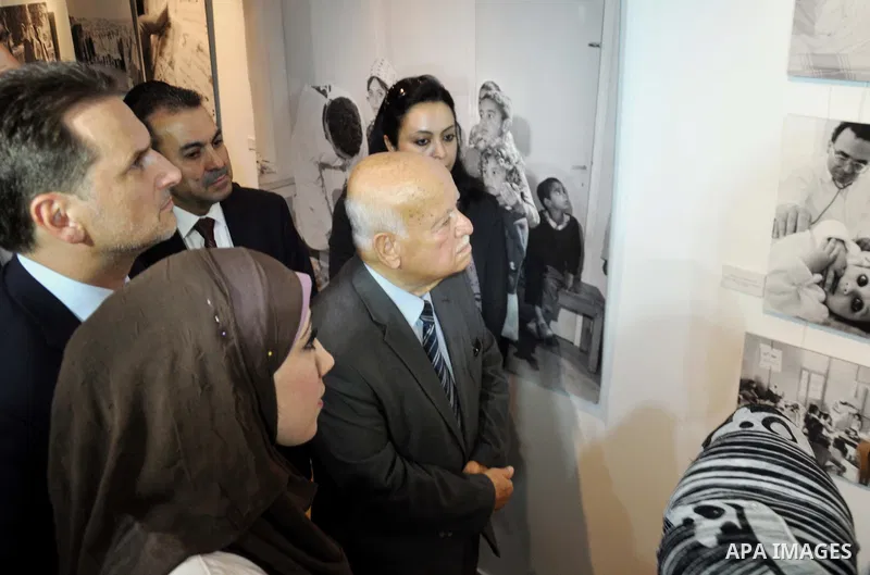 Member of the Executive Committee of the Palestine Liberation Organization, Zakaria al-Agha, takes part in the opening ceremony of the UNRWA gallery archive, in Gaza City on June 10, 2014. The gallery organized by the Un...