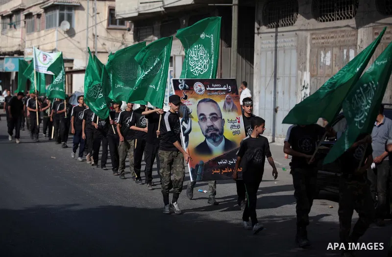 Palestinian children who participate in a summer camp organized by Hamas, march during a rally to show support of 125 Palestinian prisoners detained in Israeli jails and who have been on hunger strike for six weeks, in G...