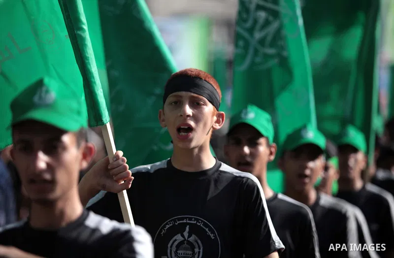 Palestinian children who participate in a summer camp organized by Hamas, march during a rally to show support of 125 Palestinian prisoners detained in Israeli jails and who have been on hunger strike for six weeks, in G...