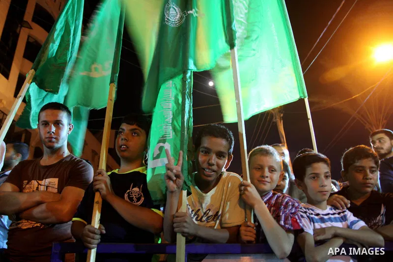 Palestinian supporters of the Hamas movement take part in a demonstration against the political arrests and the violence against Hamas members by PA security in the West Bank, in Gaza City on June 11, 2014. Security forc...