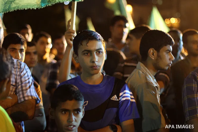 Palestinian supporters of the Hamas movement take part in a demonstration against the political arrests and the violence against Hamas members by PA security in the West Bank, in Gaza City on June 11, 2014. Security forc...