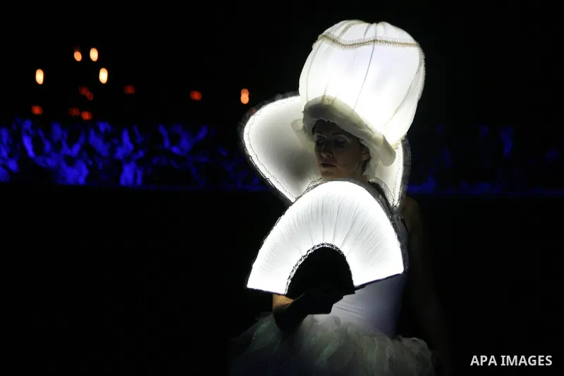 An artist participates in a show during the Jerusalem Lights Festival, in the Old City of Jerusalem, early 12 June 2014. The festival, hosting Israeli and international artists and creators, opened on late evening 11 Jun...