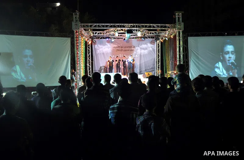 Palestinians attend a celebration to show solidarity with 125 Palestinian prisoners detained in Israeli jails and who have been on hunger strike for 51 days, in Gaza City June 12, 2014. Some 285 Palestinian prisoners are...