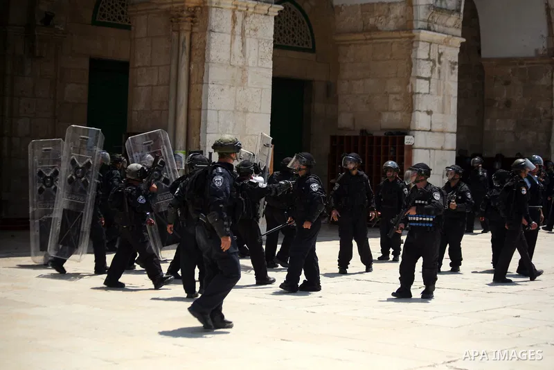 Israeli riot police take position during clashes with Palestinian youths following Friday prayers at the al-Aqsa mosque compound in Jerusalem's Old City on June 13, 2014. Photo by Saeed Qaq