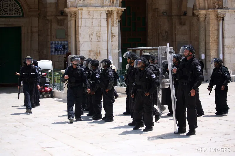 Israeli riot police take position during clashes with Palestinian youths following Friday prayers at the al-Aqsa mosque compound in Jerusalem's Old City on June 13, 2014. Photo by Saeed Qaq