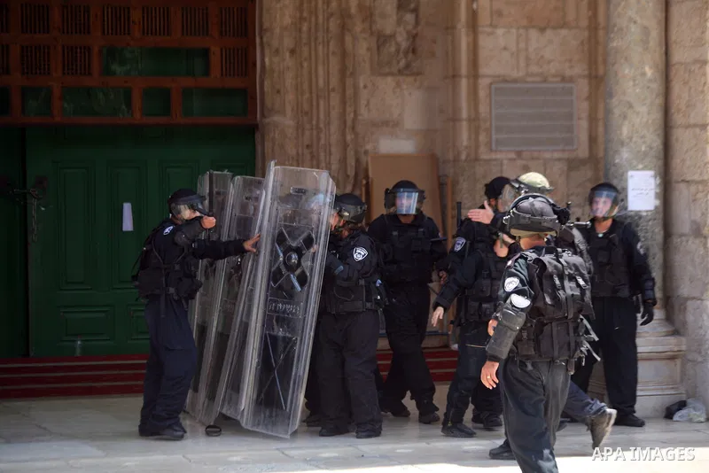 Israeli riot police take position during clashes with Palestinian youths following Friday prayers at the al-Aqsa mosque compound in Jerusalem's Old City on June 13, 2014. Photo by Saeed Qaq