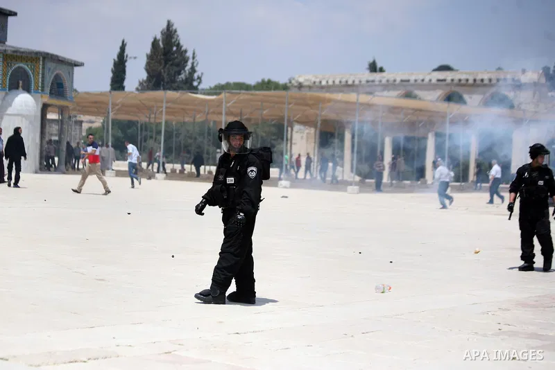 Israeli riot police take position during clashes with Palestinian youths following Friday prayers at the al-Aqsa mosque compound in Jerusalem's Old City on June 13, 2014. Photo by Saeed Qaq