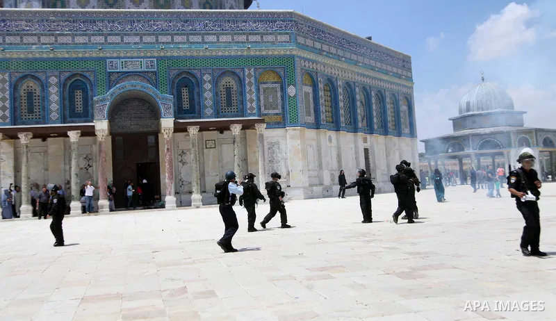 Israeli riot police take position during clashes with Palestinian youths following Friday prayers at the al-Aqsa mosque compound in Jerusalem's Old City on June 13, 2014. Photo by Saeed Qaq