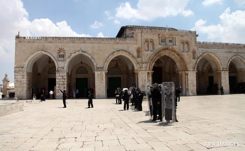 Israeli riot police take position during clashes with Palestinian youths following Friday prayers at the al-Aqsa mosque compound in Jerusalem's Old City on June 13, 2014. Photo by Saeed Qaq