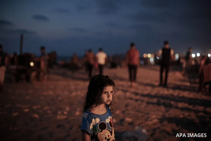 Palestinianss enjoy a summer day at the beach in Gaza city, on June 13, 2014. Friday is the Muslim holiday and as summer is entering many Palestinian people go to the beach since it is the major entertainment area in the...