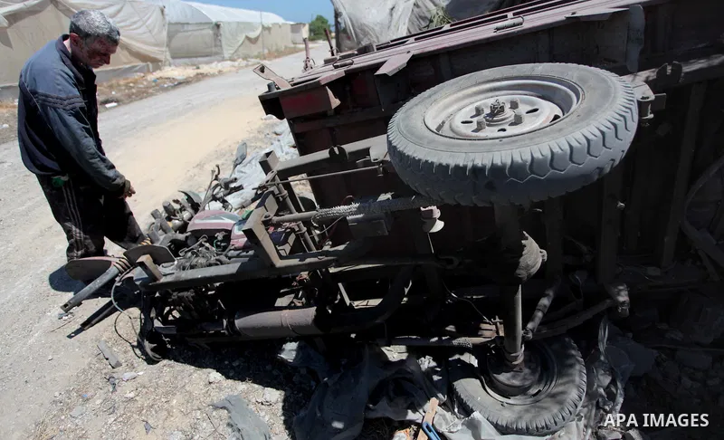 A Palestinian man inspects his car of an Israeli air strike in Rafah in the southern Gaza Strip June 15, 2014. Israeli strikes come only three days after Israeli air forces targeted a Palestinian individual associated wi...