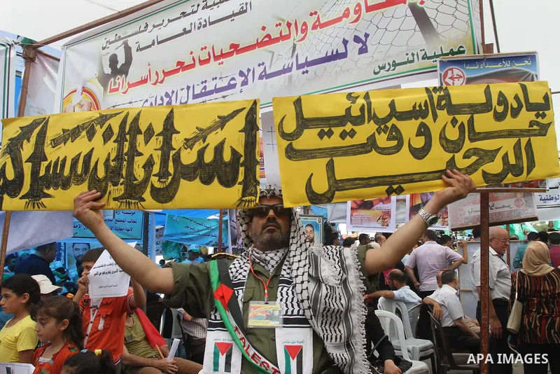 Palestinians take part in a protest in support of 125 Palestinian prisoners detained in Israeli jails and who have been on hunger strike for 55 days, in front of the Red cross office in Gaza City on June 16, 2014. Some 2...
