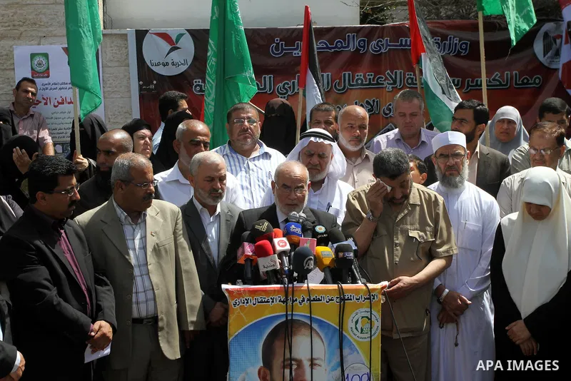 The spokesman of the Palestinian Parliament in Gaza Strip, Ahmed Bahar speaks during a protest in support of 125 Palestinian prisoners detained in Israeli jails and who have been on hunger strike for 55 days, in front of...