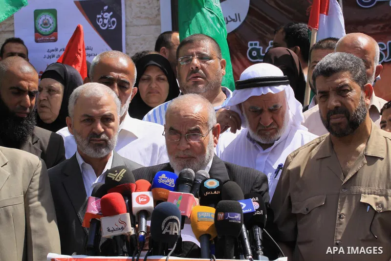 The spokesman of the Palestinian Parliament in Gaza Strip, Ahmed Bahar speaks during a protest in support of 125 Palestinian prisoners detained in Israeli jails and who have been on hunger strike for 55 days, in front of...