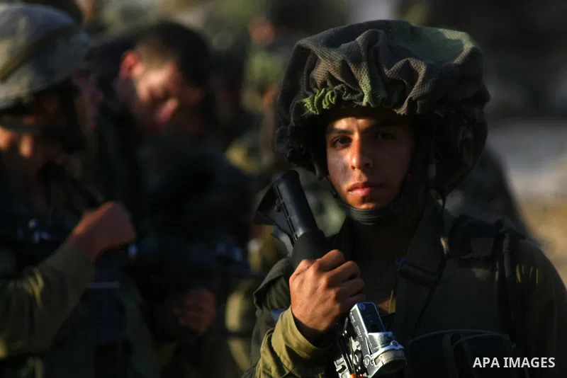 Israeli troops take part in a search operation on the outskirts of the West Bank town of Hebron on June 16,2014 as security forces broadened the search for three teenagers believed kidnapped by Palestinian militants and...