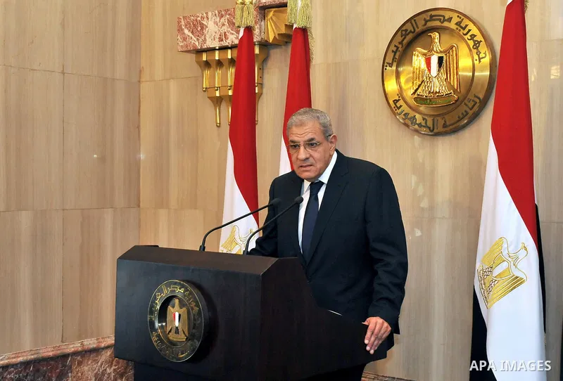 A handout picture released by Egyptian Presidency shows Egyptian Prime Minister Ibrahim Mahlab speaks to the ministers following a swearing-in ceremony for new cabinet ministers at the presidential palace in Cairo, June...